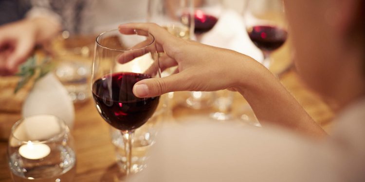 Friends having late dinner and wine at restaurant