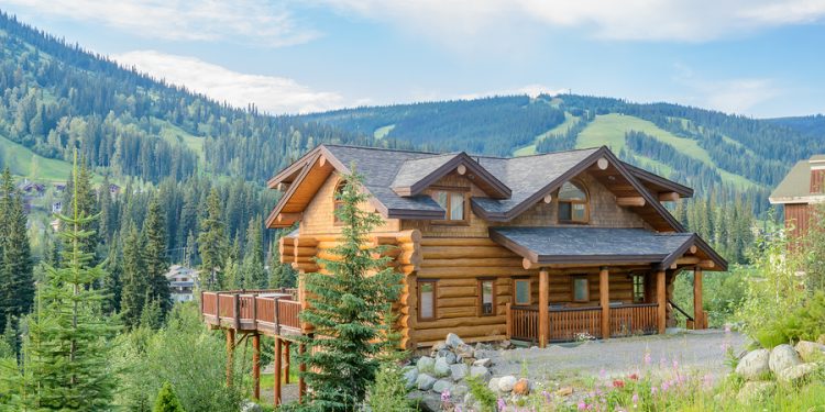 Luxury house against blue sky and gorgeous mountain landscape in Vancouver, Canada