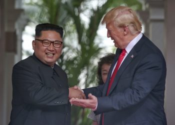 US President Donald Trump shakes hands with North Korea leader Kim Jong Un at the Capella resort on Sentosa Island Tuesday, Jin Singapore.