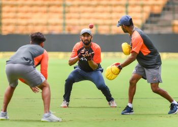 Indian players including Cheteshwar Pujara (C) go through their fielding drills, Wednesday