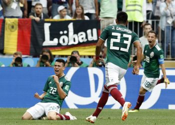 Hirving Lozano (L) celebrates with his teammates after scoring against Germany at the Luzhniki Stadium in Moscow