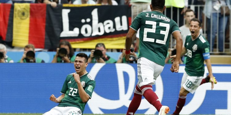 Hirving Lozano (L) celebrates with his teammates after scoring against Germany at the Luzhniki Stadium in Moscow