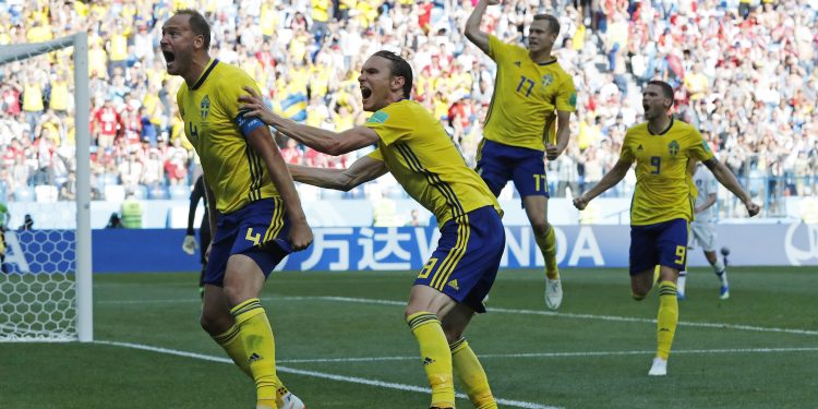 Andreas Granqvist (L)  celebrates after scoring the winner against South Korea at the Nizhny Novgorod stadium in Nizhny Novgorod, Russia