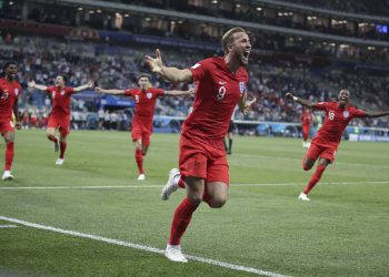 England's Harry Kane (C) celebrates after scoring against Tunisia at the Volgograd Arena in Volgograd, Russia