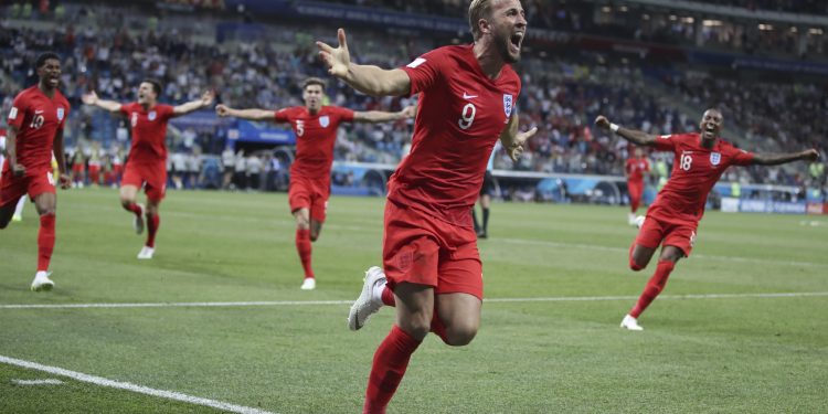 England's Harry Kane (C) celebrates after scoring against Tunisia at the Volgograd Arena in Volgograd, Russia