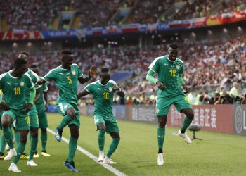 Senegal's Mbaye Niang (R) dances in celebration with his teammates after scoring the winner against Poland at the Spartak Stadium in Moscow, Russia