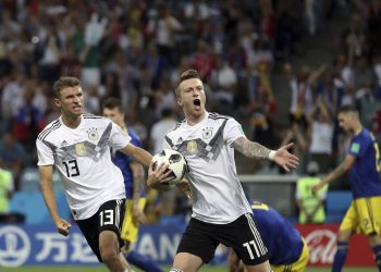 Marco Reus (R) celebrates with Thomas Mueller after scoring Germany's opening goal against Sweden at the Fisht Stadium in Sochi, Russia