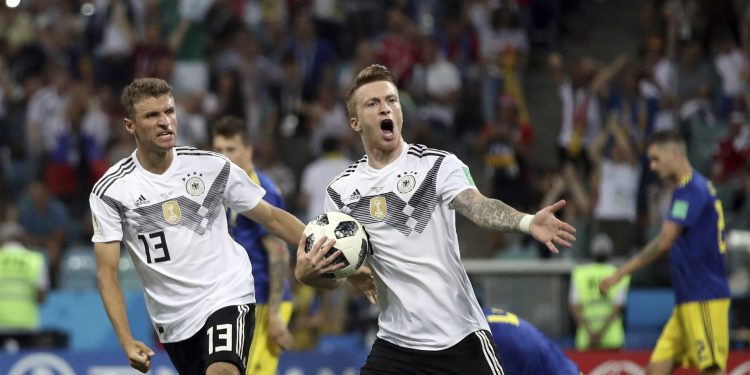 Marco Reus (R) celebrates with Thomas Mueller after scoring Germany's opening goal against Sweden at the Fisht Stadium in Sochi, Russia