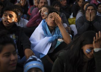 Stunned Argentina fans lament the loss of their team in Buenos Aires, Thursday 