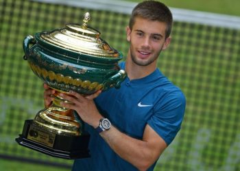 Borna Coric poses with the winner’s trophy at Halle Westfalen, Sunday