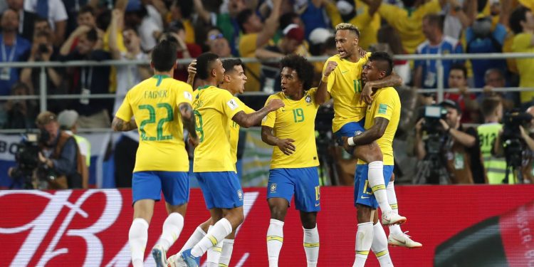 Paulinho (far R) celebrates with teammates after scoring against Serbia at the Spartak Stadium in Moscow