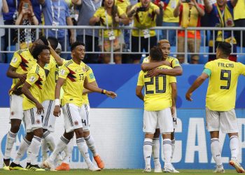Colombia's players celebrate after teammate Yerry Mina scored his side's opening goal against Senegal at the Samara Arena, Russia, Thursday