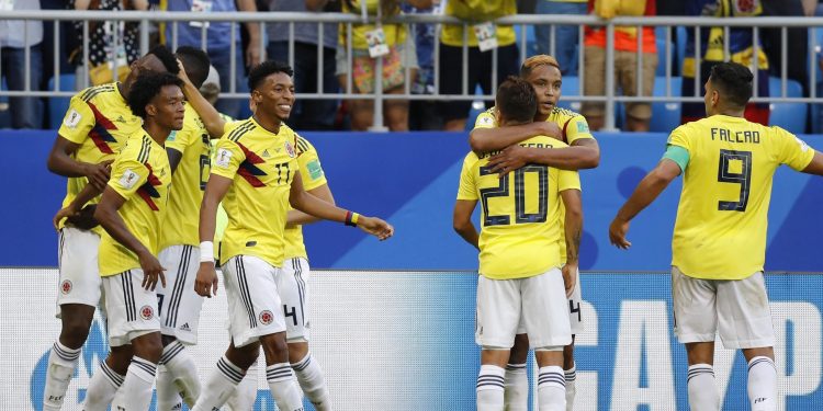 Colombia's players celebrate after teammate Yerry Mina scored his side's opening goal against Senegal at the Samara Arena, Russia, Thursday