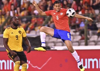 Costa Rica's Oscar Duarte (in red) goes up against Belgium's Romelu Lukaku during their friendly match at the King Baudouin stadium in Brussels