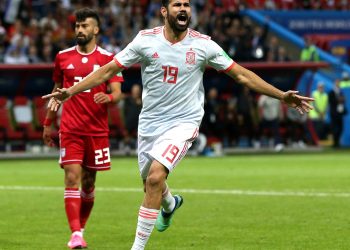 Diego Costa of Spain celebrates his fortuitous goal as hapless Iran defenders rue their luck Wednesday 