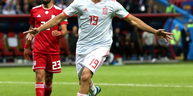 Diego Costa of Spain celebrates his fortuitous goal as hapless Iran defenders rue their luck Wednesday 