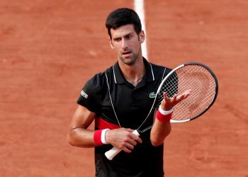 Novak Djokovic looks a dejected figure after his French Open quarterfinal defeat to unseeded Marco Cecchinato, Tuesday