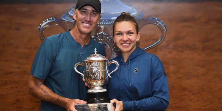 Simona Halep (R) poses with her coach Darren Cahill at Roland Garros cloakroom with her Suzanne Lenglen Cup, Saturday