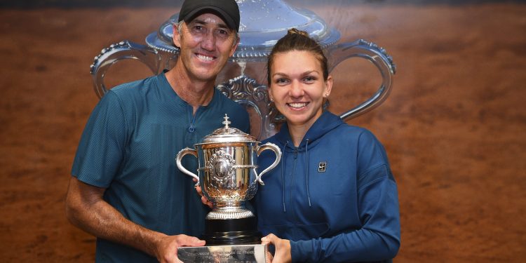 Simona Halep (R) poses with her coach Darren Cahill at Roland Garros cloakroom with her Suzanne Lenglen Cup, Saturday