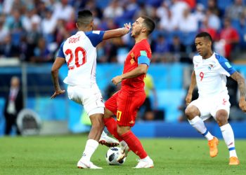 Eden Hazard (red) takes a knock on the face from a Panama player during the match, Monday   