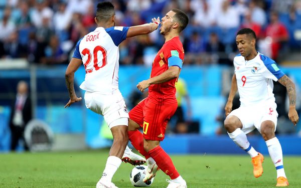 Eden Hazard (red) takes a knock on the face from a Panama player during the match, Monday   