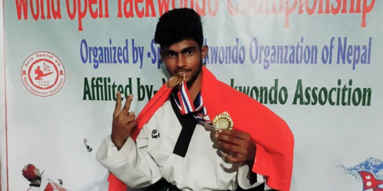 Ehsas Hota poses with his gold medals at Rupandehi in Nepal