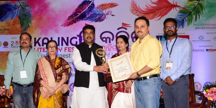 Author Amish Tripathi receiving the Kalinga International Literary Award from Union Minister Dharmendra Pradhan, Friday OP PHOTO