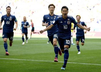 Shinji Kagawa (No.10) celebrates after scoring against Colombia, Tuesday