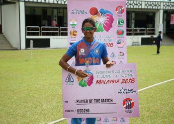 Harmanpreet Kaur poses with the player of the match cheque at Kuala Lumpur, Monday