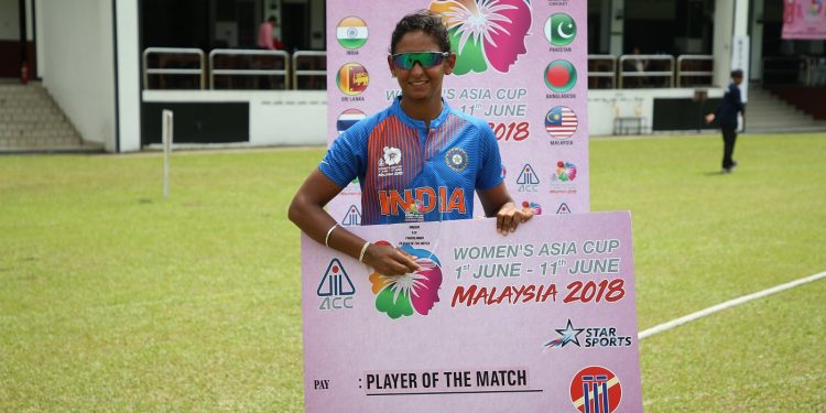 Harmanpreet Kaur poses with the player of the match cheque at Kuala Lumpur, Monday