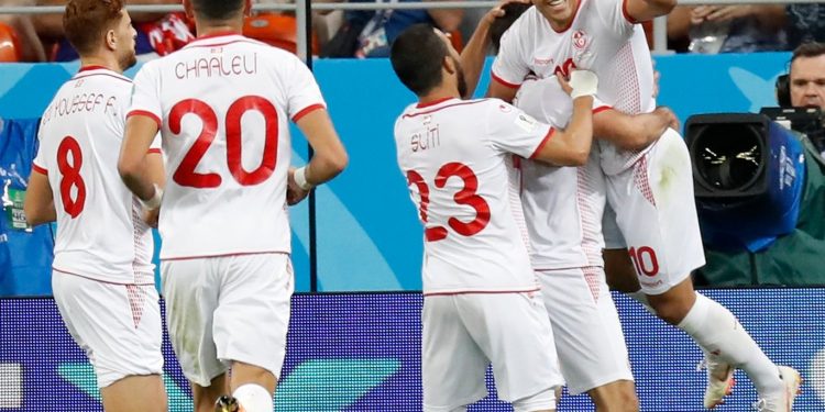 Teammates rush to congratulate Wahbi Khazri (extreme right) after his winning goal against Panama at the Mordovia Arena, Thursday