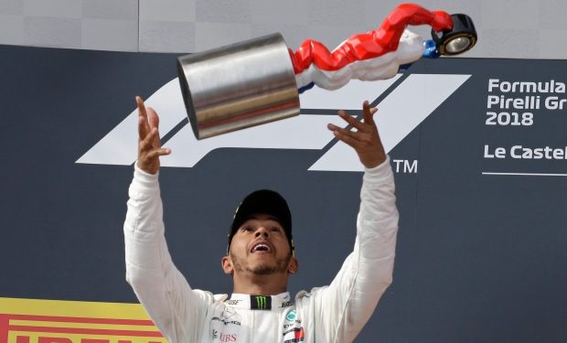 Lewis Hamilton celebrates with the French Grand Prix trophy, Sunday