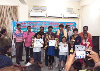 Winners of Odisha State U-11 Chess Championships pose with their trophies and certificates along with guests at Puri, Sunday   