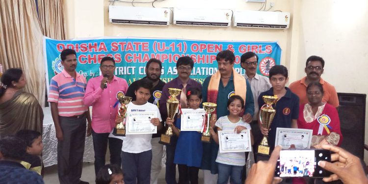Winners of Odisha State U-11 Chess Championships pose with their trophies and certificates along with guests at Puri, Sunday   