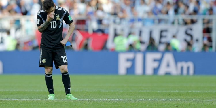 Lionel Messi covers his face after missing the penalty against Iceland at the Spartak Stadium in Moscow