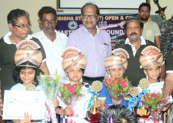 Winners and runners-up of the various categories of Odisha State U-7 Chess Championships pose with their trophies and certificates along with guests in Bhubaneswar, Friday  