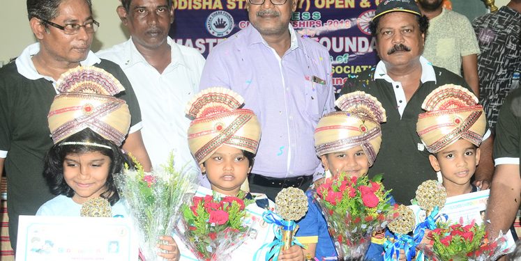 Winners and runners-up of the various categories of Odisha State U-7 Chess Championships pose with their trophies and certificates along with guests in Bhubaneswar, Friday  