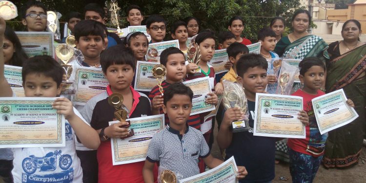 Winners of State Schools’ Open Chess Championship pose with their trophies and certificates in Bhubaneswar, Sunday    