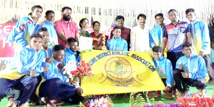 Balasore players pose with their winners’ trophies along with officials at Athgarh, Sunday    