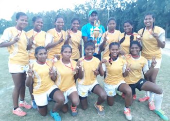 Odisha women’s rugby team players pose with their medals and winners’ trophy at Chandigarh, Sunday   