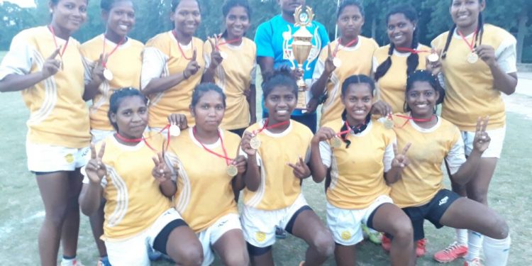 Odisha women’s rugby team players pose with their medals and winners’ trophy at Chandigarh, Sunday   