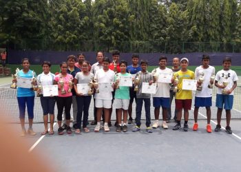 Winners of the TAB AITA-OTA Championship Series tennis tournament pose with their trophies and certificates along with officials in Bhubaneswar, Friday    