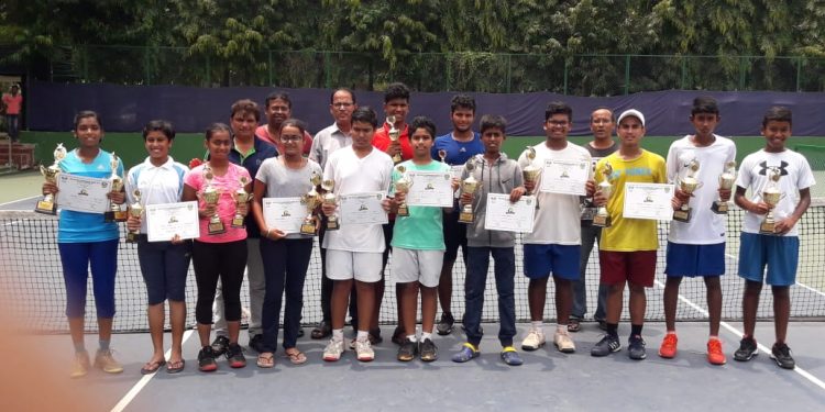 Winners of the TAB AITA-OTA Championship Series tennis tournament pose with their trophies and certificates along with officials in Bhubaneswar, Friday    
