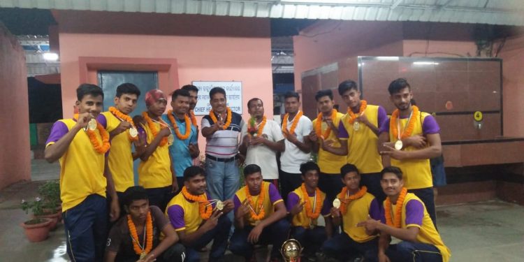Odisha Kabaddi team players and officials pose with their medals and trophies Saturday     