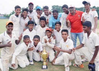 Cuttack-A players and officials pose with the winners’ trophy at Cuttack, Friday     