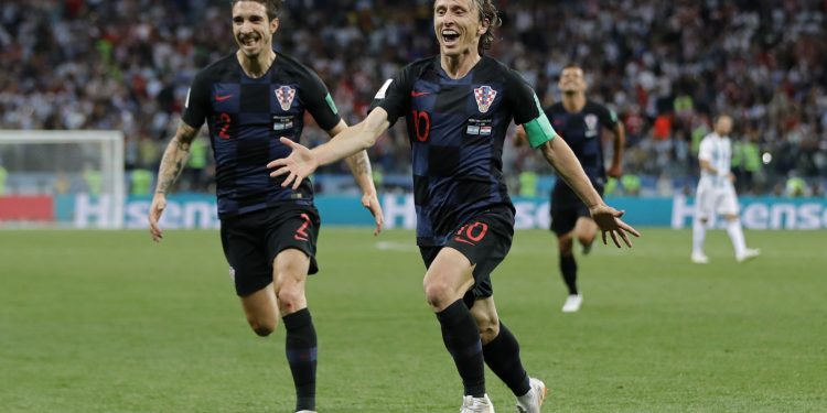 Luka Modric (R) celebrates with teammates after scoring against Argentina at the Nizhny Novgorod Stadium, Russia