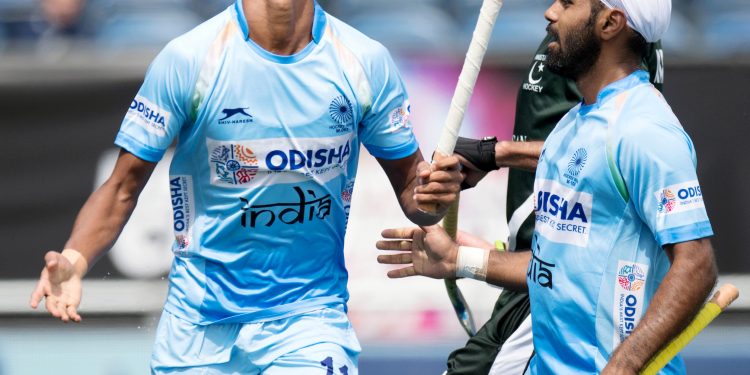 Mandeep Singh of India celebrates after scoring the third goal for India against Pakistan in the Champions Trophy encounter, Saturday