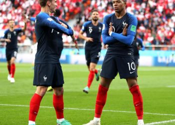 France’s Kylian Mbappe (R) does his trademark celebration pose after scoring against Peru at Yekaterinburg, Thursday