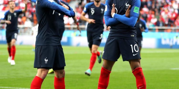 France’s Kylian Mbappe (R) does his trademark celebration pose after scoring against Peru at Yekaterinburg, Thursday