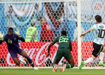 Lionel Messi (No.10) watches as the ball is about to beat Nigerian keeper Francis Uzoho for Argentina’s first goal, Tuesday